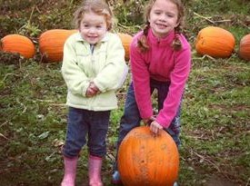 girls in pumpkin patch