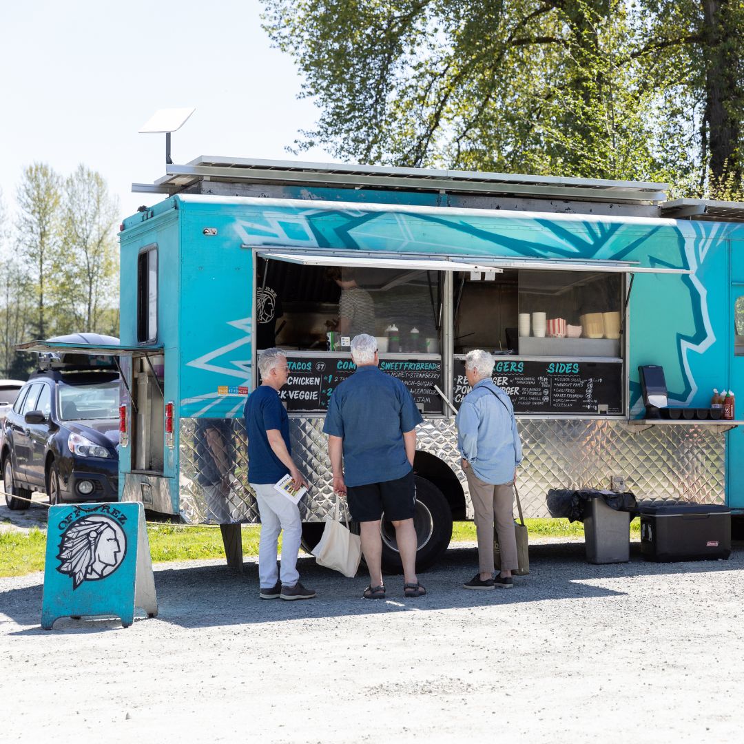 Visitors ordering food from the Off the Rez food truck during the Oxbow Native Plant Festival.