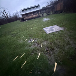 Planting cones scattered across flooded field after storm