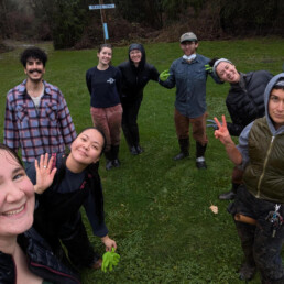 Oxbow staff smiling together during flood cleanup efforts
